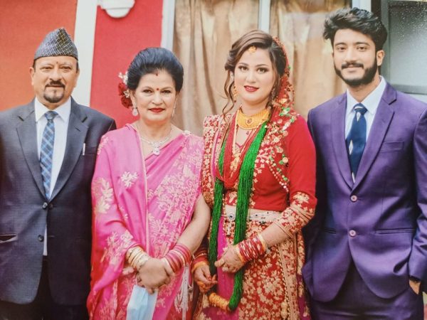 Swarup Dhakal with his wife and family