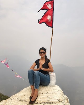 Sipora Gurung with national flag of Nepal