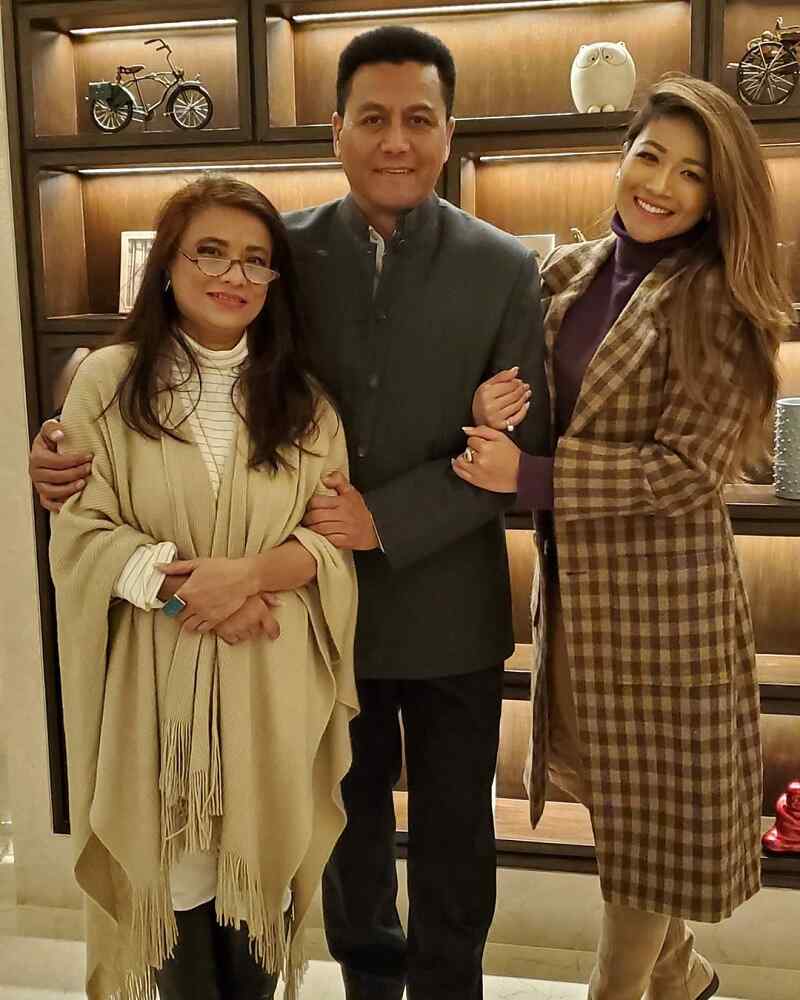 Evana Manandhar with her father and mother